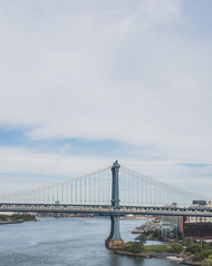 Manhattan Bridge over East River and Main Street Park, in Brooklyn, New York, USA