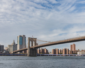 Fototapeta na wymiar Brooklyn Bridge over East River with skyline of Manhattan, in New York, USA