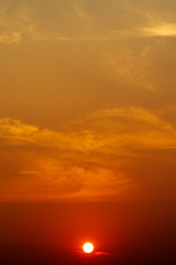 Obraz premium Sky in the sunset time and orange light of the sun through the clouds in the sky