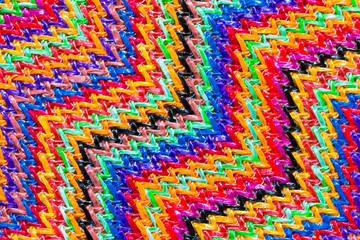 Abstract textured zigzag background of close up detail in woven raffia