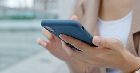 Close up of woman use of mobile phone at outdoor