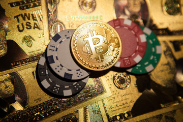 Fototapeta na wymiar Colorful casino chips, dollars, bitcoins and red dice