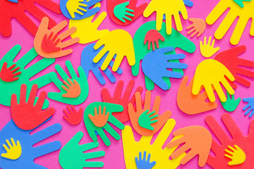 Fototapeta premium Brightly colored foam hand shapes of red, orange, yellow, green and blue