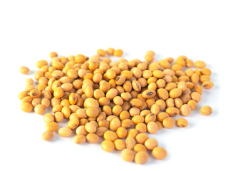 Raw dried soybeans isolated on white background.