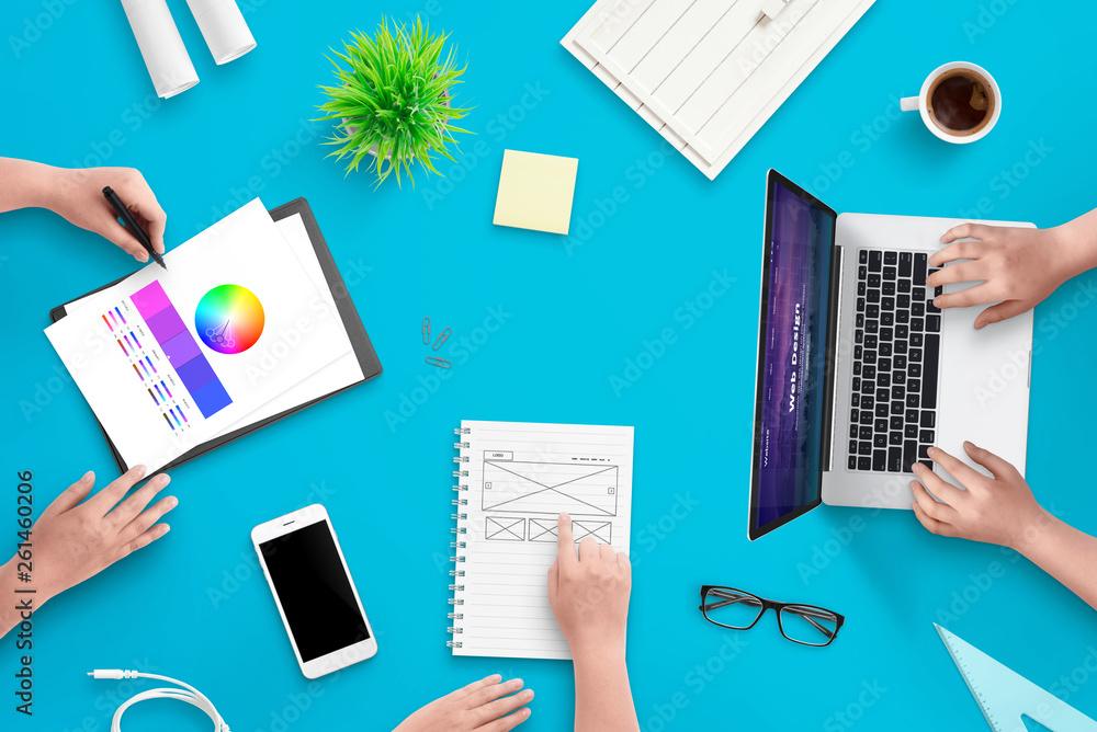 Fototapete Development team work on user interface web project. Concept of work space. Top view scene.