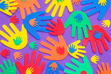 Brightly colored foam hand shapes of red, orange, yellow, green and blue