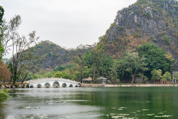 Fototapeta premium Seven star bridge, mountains around Seven-star Crags Scenic Area