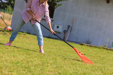 Woman raking leaves