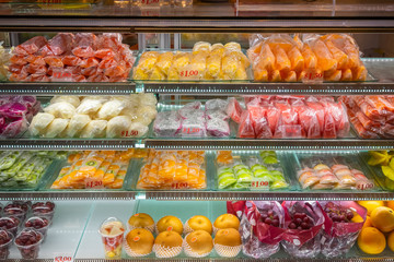 Variety of tropical fruits on display in a display fridge in Singapore