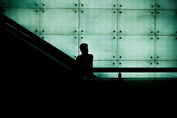 person on escalator