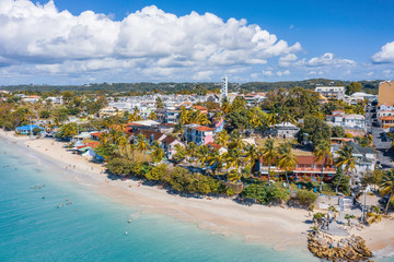 Scenic aerial view of La Datcha beach (Le Gosier plage) in Guadeloupe. Beautiful summer sunny look of small paradise tropical island in Caribbean sea. Several boats and yachts in blue sea. - obrazy, fototapety, plakaty