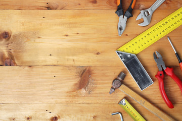 Working tools on wooden rustic background with copy space