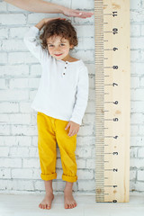 Child measures height 