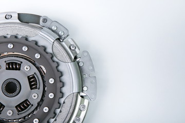 a part of car automatic transmission clutch basket. clutch with disk DSG on white background from the side. auto parts on a white background with copy space.