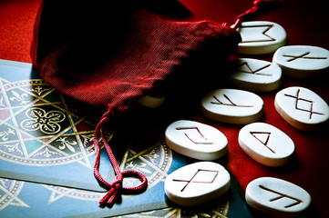 white stones with ancient symbols of runes like esoteri topic 