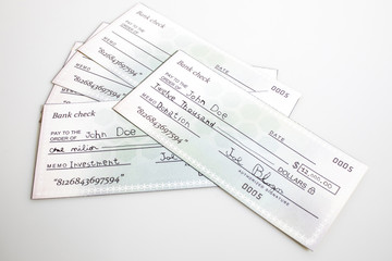 Many bank check isolated in a white background
