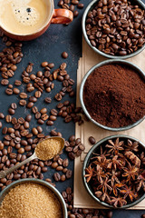 Assortment of coffee varieties on a black background. Top view. Free space for your text