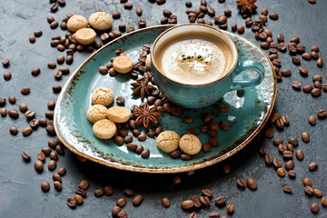 Coffee cup with cookies  on  dark table