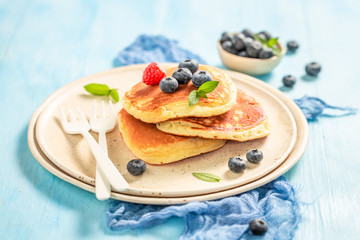 Yummy american pancakes with fresh blueberries and sugar