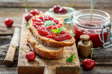Tasty sandwich with jam made of cherries