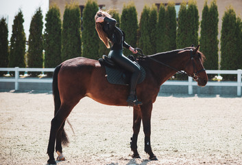 Spring - summer season, concept of hobby, Woman with a horse on a nature, relationship human and...
