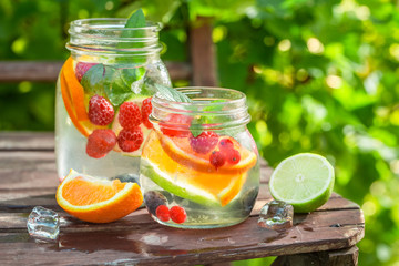 Healthy lemonade with mix of citrus in sunny day
