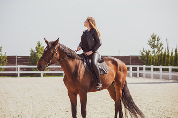 Spring - summer season, concept of hobby, Woman with a horse on a nature, relationship human and animals 