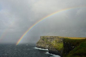 A rainbow over the Cliffs of Moher in Ireland.