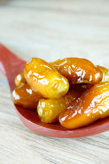 sweet algerian dates fruits on wooden spoon