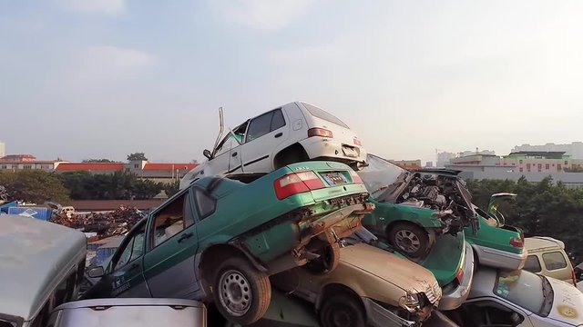 GUANGZHOU, CHINA. Aerial footage of hundreds of thousands of vehicles thrown on the scrap heap. China&rsquo;s car graveyard.