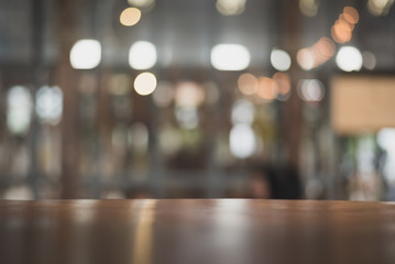wooden table on light bokeh background in the restaurant