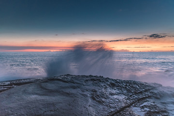 Rock Platform Dawn Seascape with Light Smattering of Clouds