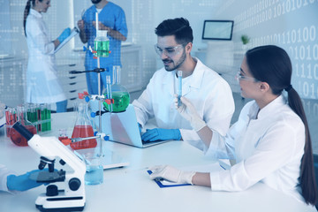 Medical students working in modern scientific laboratory, color tone