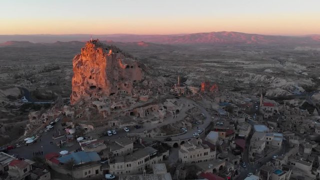 Aerial view to U&ccedil;hisar castle and the city, during sunset, Cappadocia, Turkey