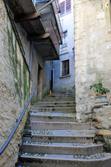 Fototapeta na wymiar Old narrow street on the island of Isola Bella on lake Maggiore, Italy