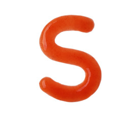 Letter S written with red sauce on white background