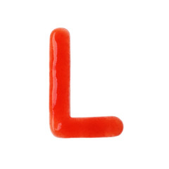 Letter L written with red sauce on white background