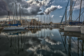 Fototapeta na wymiar A view of Boats and yachts in La Cala bay