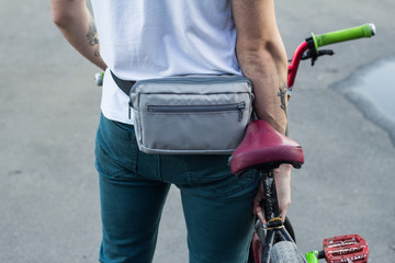 Obraz premium Young male with bmx bicycle stand alone outdoors 