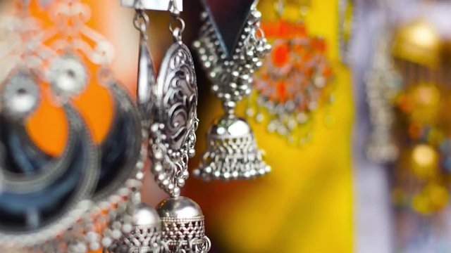 Handmade silver semi precious jewellery shot with movement and a shallow depth of feild in jaipur rajasthan india