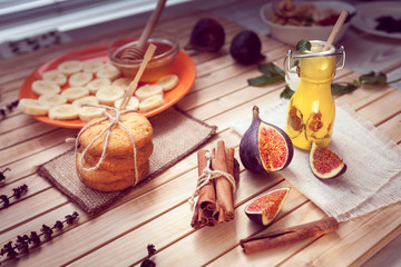 the yogurt with a fig in glass jars and cinnamon, cookie and honey with banana