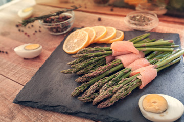bunches of asparagus wrapped in salmon with spices