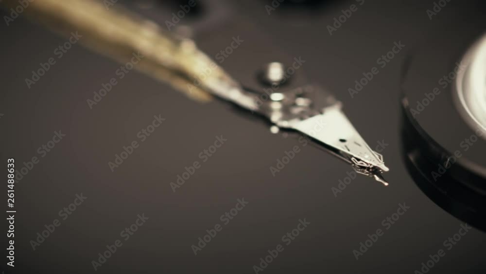 Poster macro shot of the head of computer hdd or hard disk drive