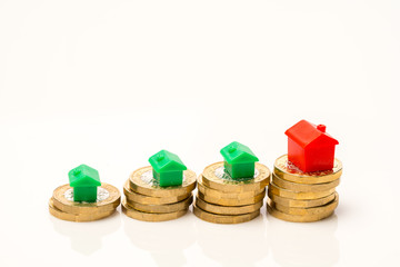 Housing estate concept with coins in studio