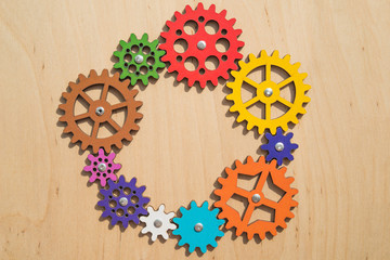 mechanism of multi-colored gears, assembled puzzle. Business concept idea, teamwork, cooperation....