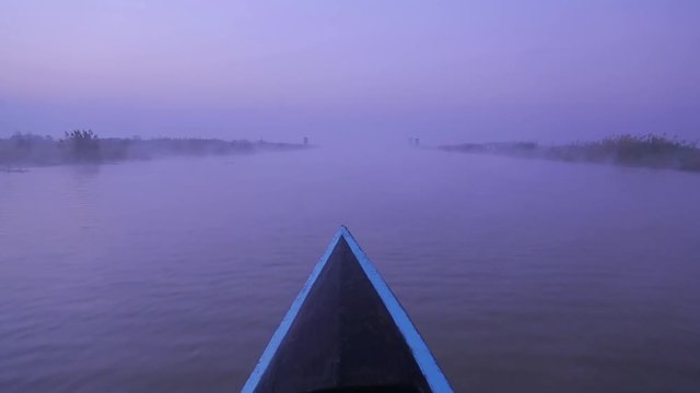 IRRAWADDY RIVER, MYANMAR. A leisurely boat ride upriver - POV from the boat. Tourists discover rural life along the river&rsquo;s banks
