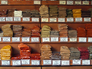 piles of colorful spices at a food market