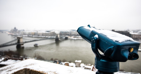 Blue telescope and aerial view Budapest city on background
