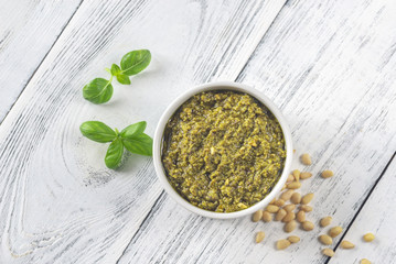 Bowl of pesto on the wooden table