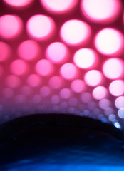 Vertical pink and blue light circles abstract background